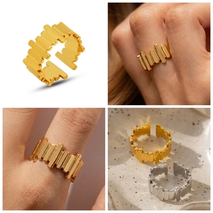 Detailed views of irregular geometric open ring in polished gold and silver finishes
