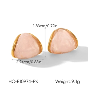 Detail view of pink resin triangle stud earrings with gold plating and size measurements
