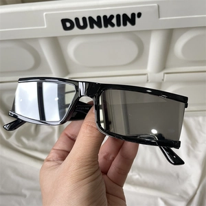 Detail shot of black rectangular cycling sunglasses showing inner temple specifications