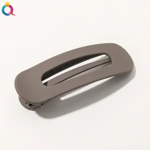 Close-up of matte Morandi grey hollow duckbill hair clip with a smooth frosted finish