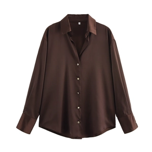 Detail of chocolate brown satin long sleeve shirt showing classic collar and button placket