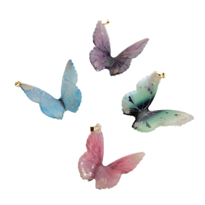 DIY resin butterfly pendants with gold foil and gradient colors in blue, purple, and green
