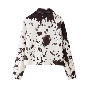 Back view of a cropped cow print jacket featuring lapel collar and adjustable hem buckles