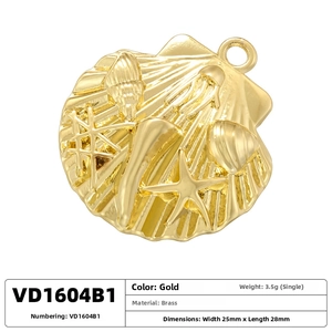 Detailed close-up of golden brass scallop shell pendant with embossed starfish and jellyfish