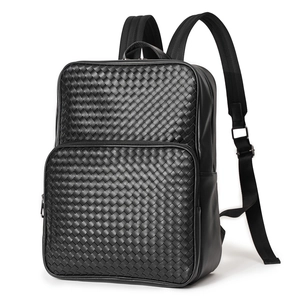 Side view of black woven leather business backpack highlighting refined texture and craftsmanship