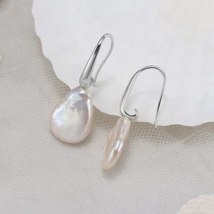 Elegant S925 sterling silver baroque pearl drop earrings with iridescent luster on shell