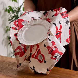 Festive Santa Claus print cotton linen napkin on table with rustic holiday decor