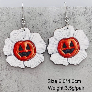 Detail view of Halloween pumpkin and flower wooden earrings with size and weight specs