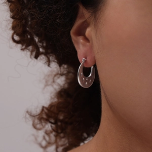 Minimalist silver U-shaped geometric earrings in polished titanium steel with textured detail