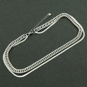 Double-layered silver titanium necklace featuring Cuban and snake chains on black background