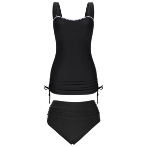 Detail of black two-piece swimsuit featuring white scalloped trim and side drawstring ties