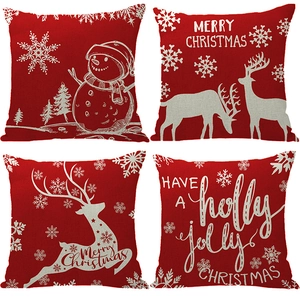 Set of four red Christmas linen pillowcases with reindeer and snowflake festive prints