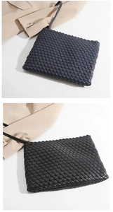 Detailed close-up of premium hand-woven leather clutch bags in black and navy blue