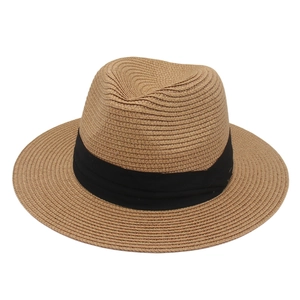 Classic straw Panama hat in khaki with a wide black ribbon and flat brim for summer