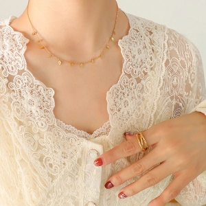 18K gold plated titanium necklace with leaf charms and layered crossover ring