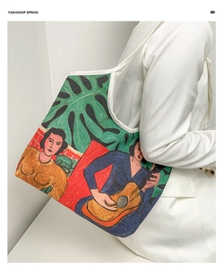 Artistic canvas tote bag with colorful oil painting illustration showing detailed fabric texture