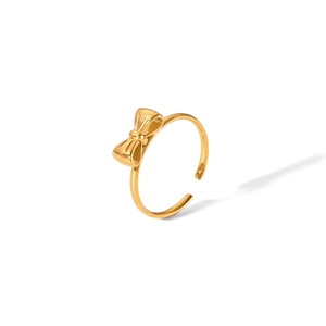 Detailed view of an 18K gold bow-shaped open ring with a high-polished finish