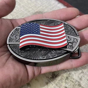 Close-up of 3D embossed US flag belt buckle with intricate scroll patterns