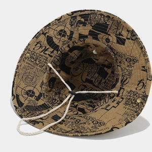 Retro newspaper print khaki bucket hat with adjustable white chin cord for outdoor sun protection