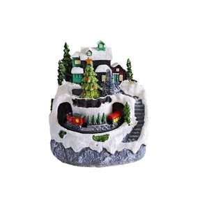 Rotating musical resin Christmas tree village with a miniature train and snowy house