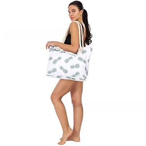 Detailed view of the large beach tote bag with pineapple print and thick rope handles