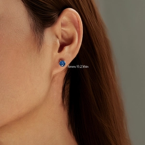 S925 sterling silver octagon royal blue rose cut stud earrings shown on ear, size 6mm
