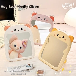 Detail of cute bear and cat desktop mirrors with foldable stand in a cozy bedroom setting