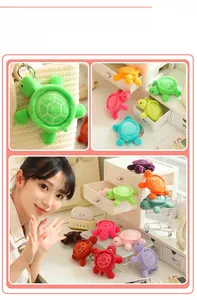Detailed view of colorful plush turtle keychains in various bright soft fabrics