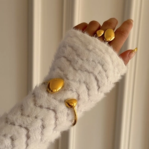 Polished 18k gold plated stainless steel irregular rings and bracelets worn by model