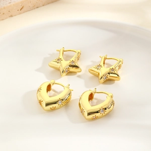 Exaggerated hollow heart and star earrings set with cubic zirconia in gold finish