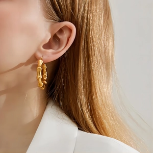 Minimalist 18K gold plated stainless steel bamboo hoop earrings for women shown on model
