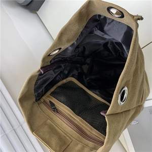 Canvas travel backpack interior with khaki lining, zipper pocket and mesh compartment