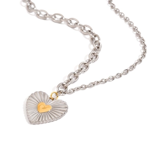 Silver heart pendant necklace with gold center on a chunky chain jewelry for women