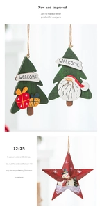 Detail of wooden Christmas tree and star ornaments with festive snowman and Santa motifs