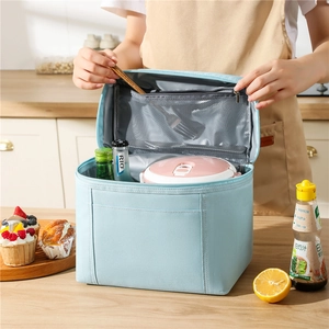 Close-up of insulated lunch bag interior with mesh pocket and zipper closure system