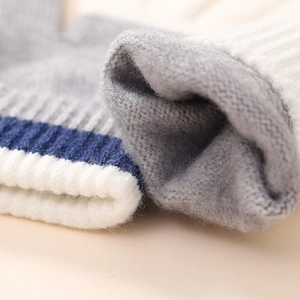 Winter thermal knit gloves for kids with thick ribbed cuffs and striped wool texture