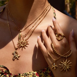 Layered gold stainless steel necklace with sun and seahorse pendants for women