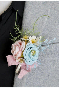 Detail of pink and blue rose boutonniere pinned on a grey suit lapel for wedding