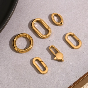 Macro detail of 18K gold plated stainless steel lobster clasps and geometric spring rings