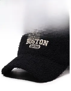 Close-up of black teddy fleece baseball cap featuring white BOSTON 1630 embroidery
