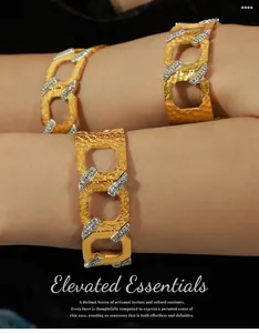 Detail of three hammered gold bracelets with cubic zirconia and geometric link design