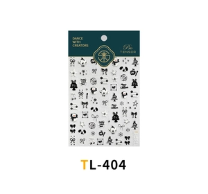 Close-up of black and white Christmas nail stickers with cute dog and bow patterns