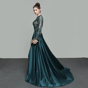 Elegant dark green long sleeve sequin evening gown with a satin detachable train