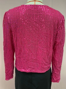 Detailed view of rose pink sequin texture on a stylish short jacket for women