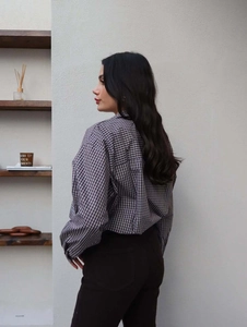 Vintage lapel button-down shirt with black and white plaid pattern and back pleat detail