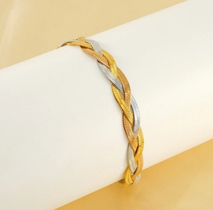 Close-up of triple-layered woven flat herringbone chain in gold and silver mixed tones