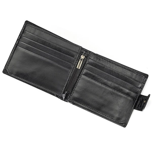 Detail view of the open black leather wallet showing multiple card slots and zipper pocket