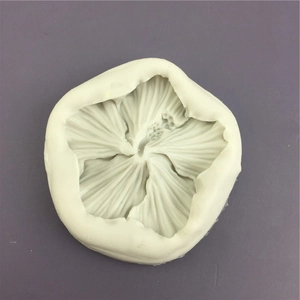 Off-white hibiscus flower silicone mold for DIY crafts and baking with detailed petal texture