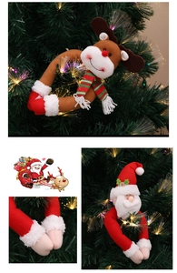 Plush Christmas curtain buckle with Santa and elk design on a festive tree