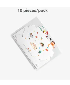 Flat-lay set of 10 DIY foldable Christmas gift boxes with festive cartoon patterns